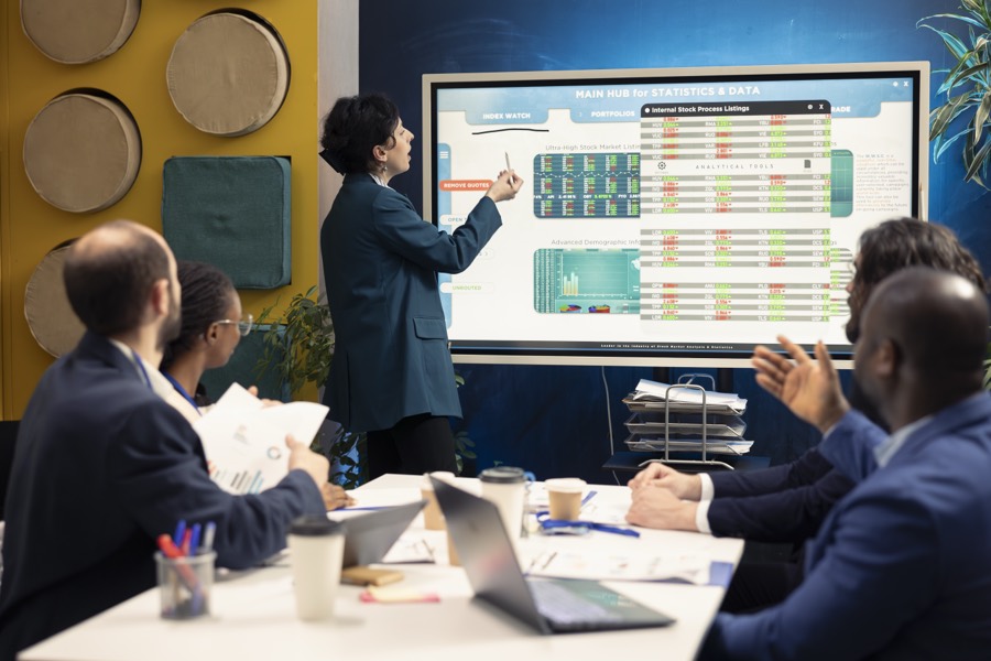 Walking a team through a project plan on a large display