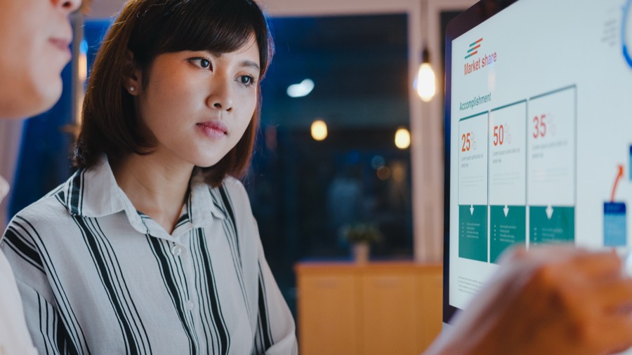 Business owners reviewing results together on a screen